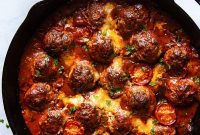 Melty Mozzarella Meatball Bake with Arugula