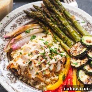 Mediterranean couscous bowl in small dish showing spread of ingredients