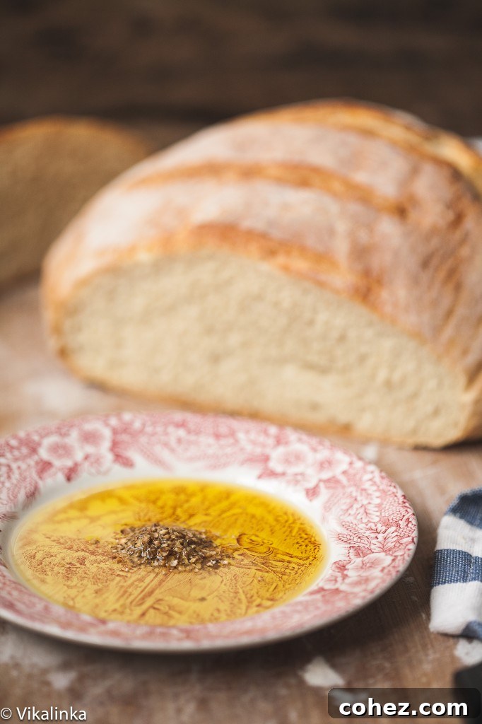 Cut loaf of bread with dukkah spice dip