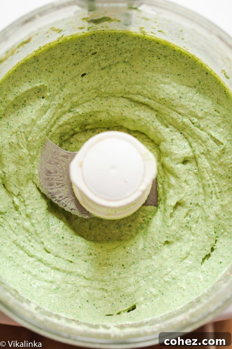 Velvet Cilantro Walnut Dip 5 Top down view of cilantro and walnut dip in a blender