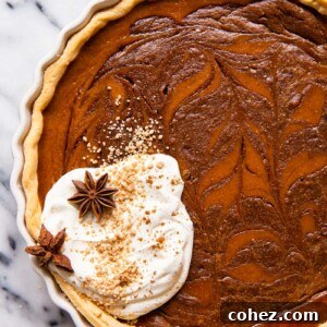 Chocolate Swirl Pumpkin Bliss 6 Pumpkin pie with chocolate swirl and whipped cream.