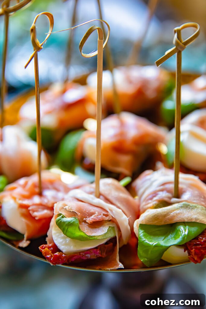 caprese bites arranged on platter with toothpicks