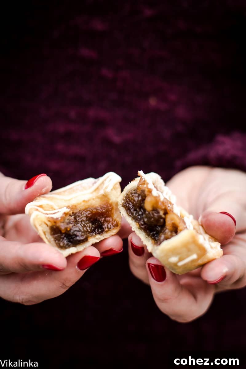 Maple Butter Tart broken in half with filling exposed