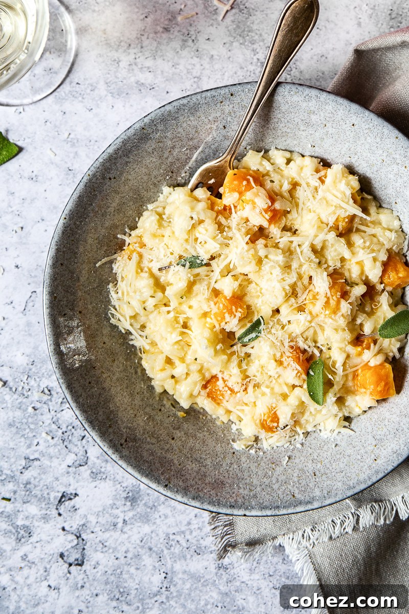 Top-down view of Butternut Squash Risotto in a bowl with a fork, ready to be eaten.