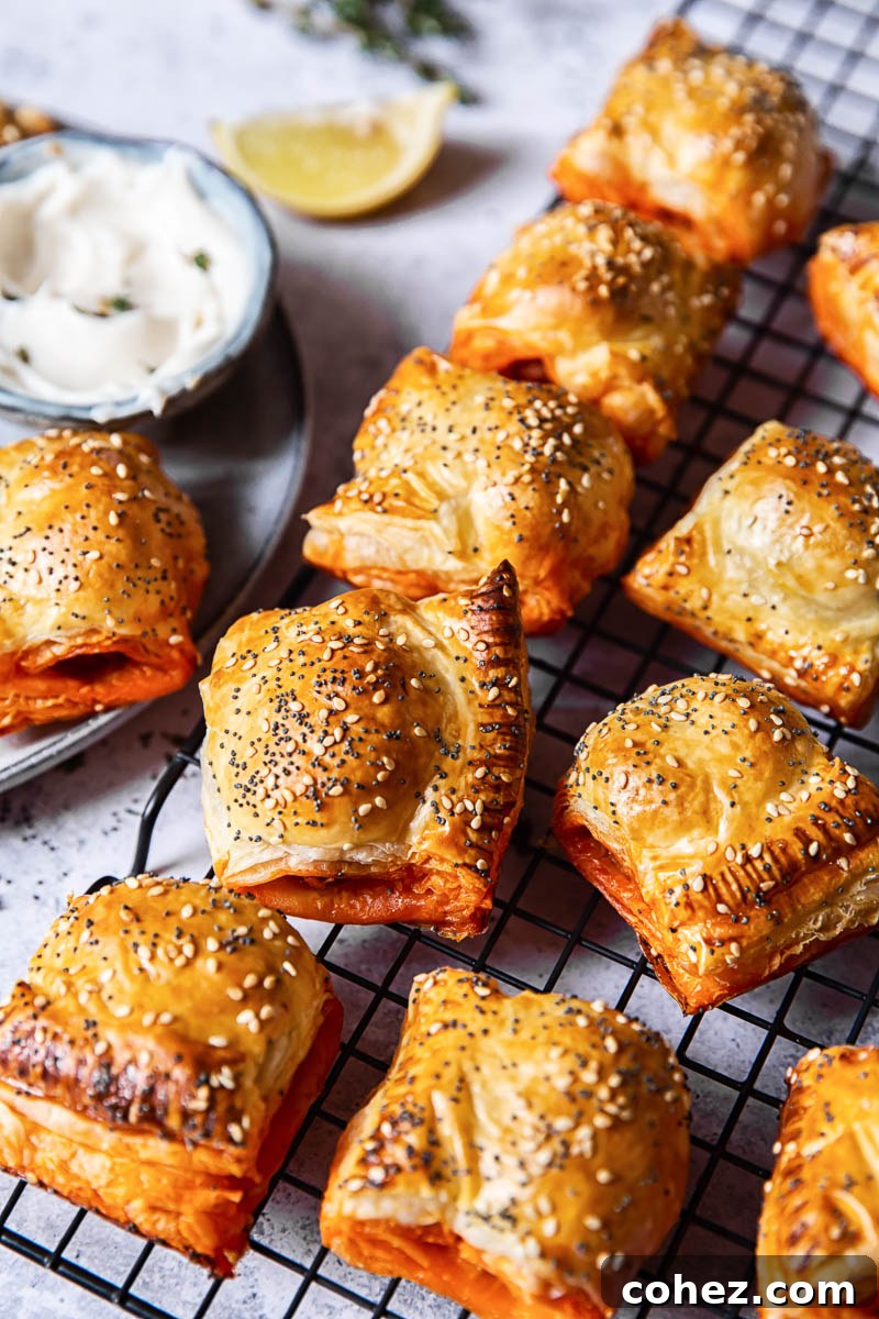 Golden brown chorizo sausage rolls cooling on a wire rack