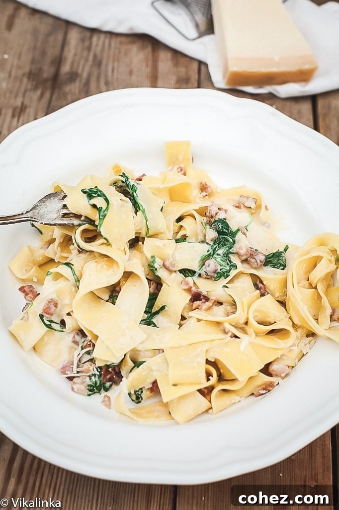 top down view of carbonara on a white plate, ready to be served