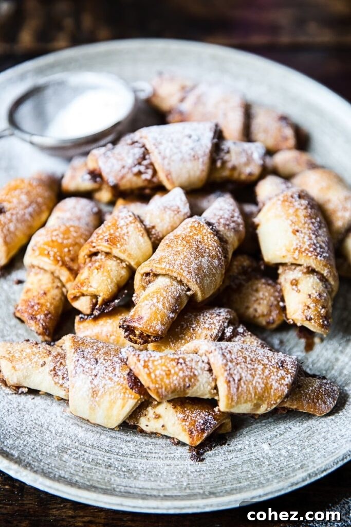 Honey, Cinnamon and Walnut Rugelach (Rogaliki) beautifully arranged on a serving platter