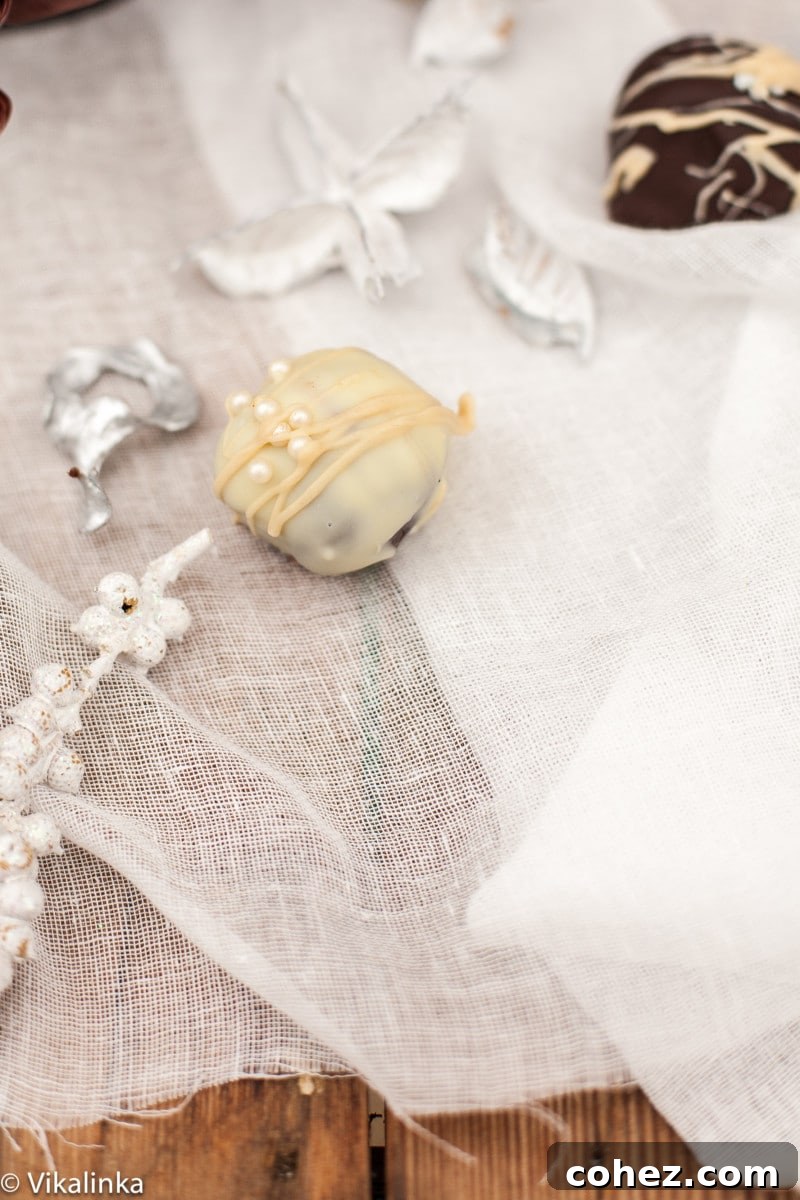 Extreme close-up of a single Baileys Truffle, showcasing its rich coating and tempting texture.