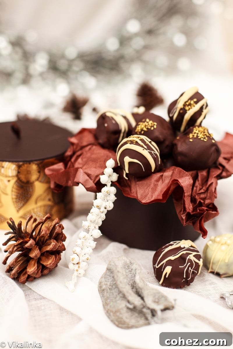 Side view of elegantly arranged Baileys Truffles, some dusted with cocoa, others adorned with festive sprinkles.