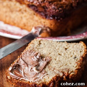 A slice of Nutella banana bread with the Nutella swirl visible on top.