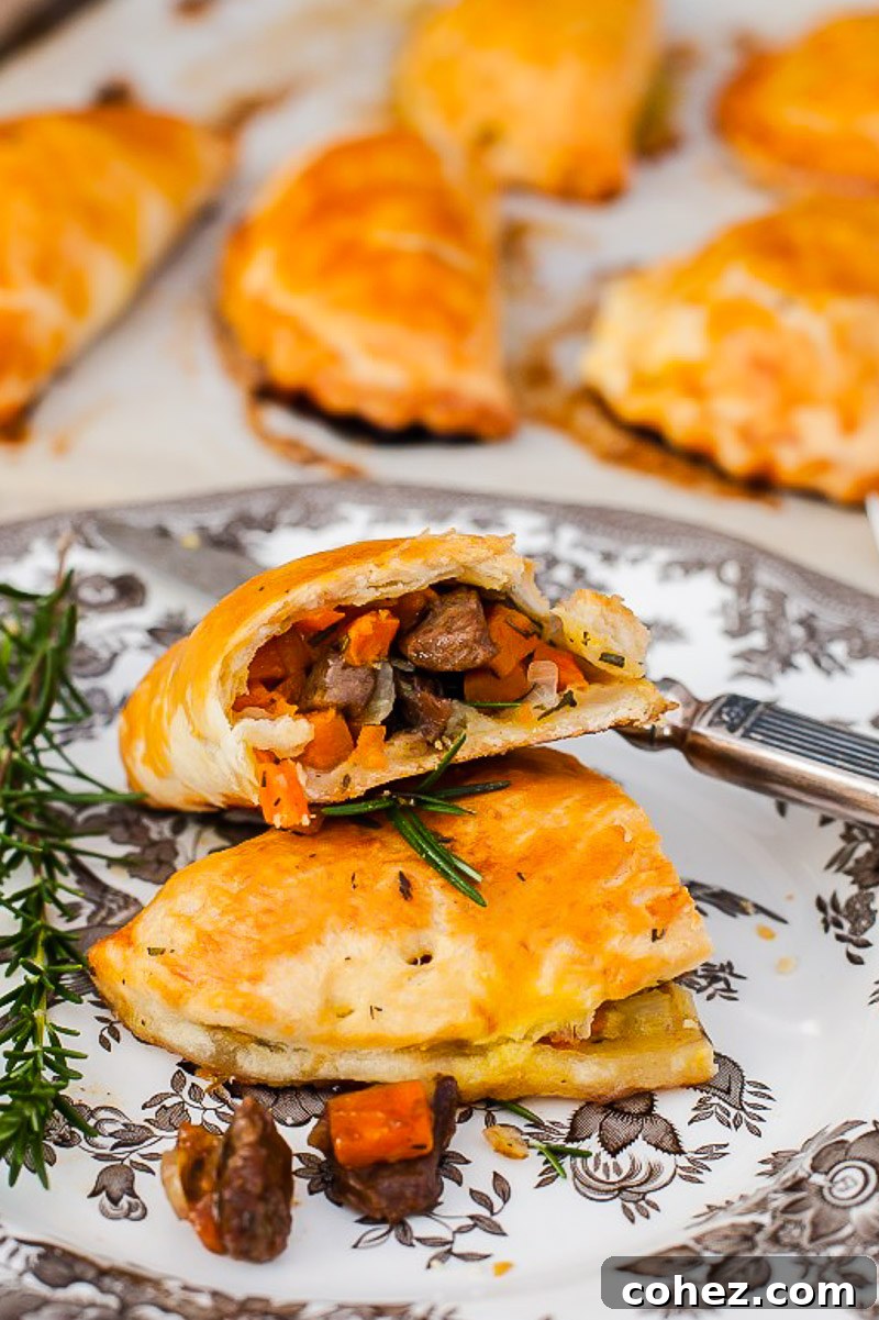 Cornish Comfort Steak and Sweet Potato Pasty 2 Cornish pasty broken into two on a plate, showcasing the filling