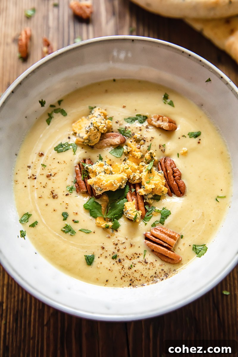 Velvety Cauliflower Cheese Soup 2 Cauliflower cheese soup topped with crumbled Stilton, toasted pecans and fresh parsley
