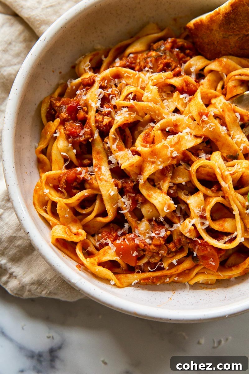 Tagliatelle with red meat sauce in bowl
