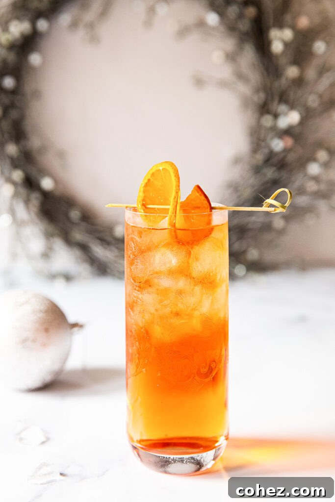 Negroni Sparkle 5 Negroni fizz on a table with wreath in the background