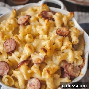 Pot of macaroni and cheese with kielbasa, ready to be baked.