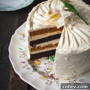Angled view of the cake with slice removed, highlighting the layers and frosting