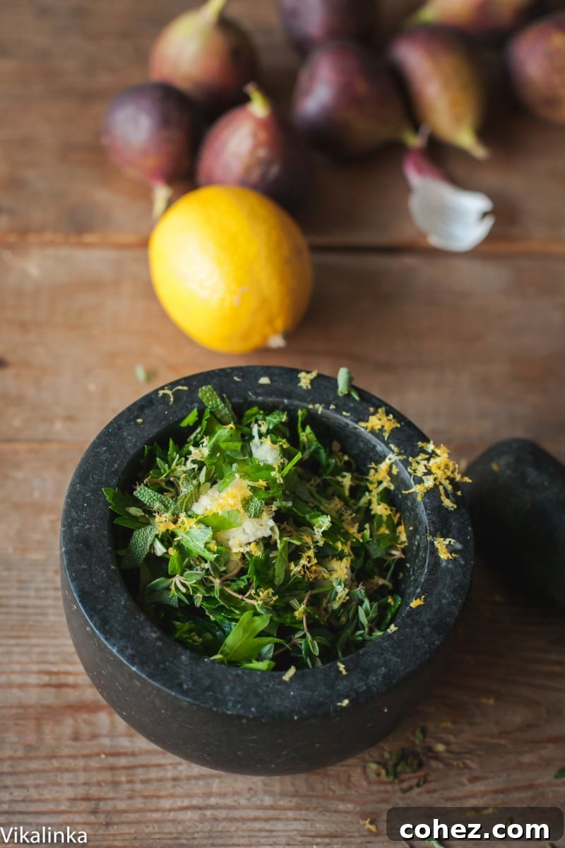 Mastering the Art of Perfect Turkey Roasting 5 Close-up of freshly chopped herbs (rosemary, thyme, sage, parsley) and grated lemon zest being combined in a mortar and pestle, highlighting the aromatic ingredients for a turkey rub.