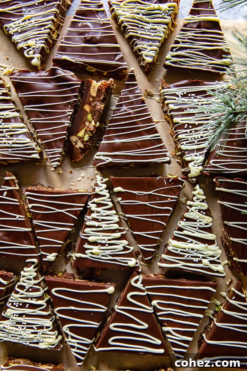 No-Bake Bliss Bars 3 Top-down view of Christmas tree shaped fridge cake with white chocolate drizzle