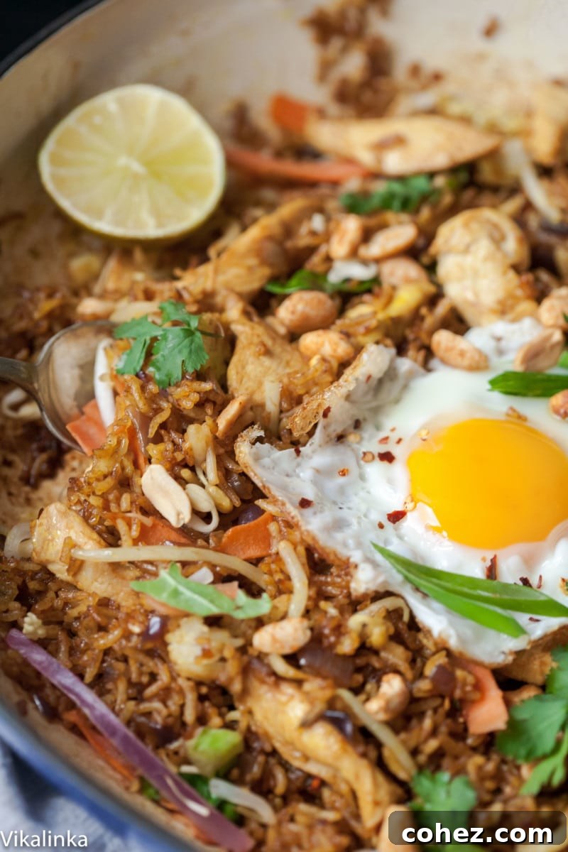 20-Minute Nasi Goreng Authentic Indonesian Fried Rice 3 Close up of Nasi Goreng in a pan, highlighting the cooked rice grains and spices
