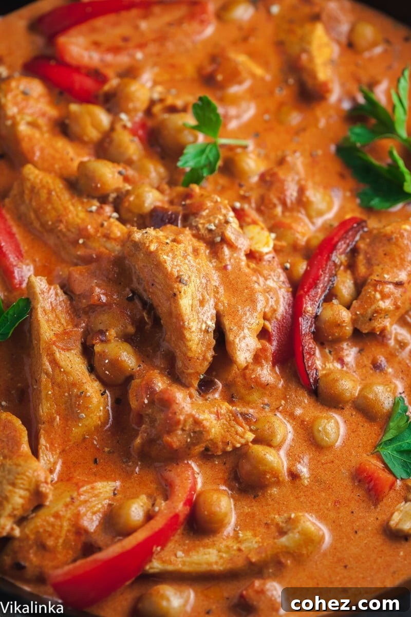 chicken paprikash with chickpeas and red peppers closeup