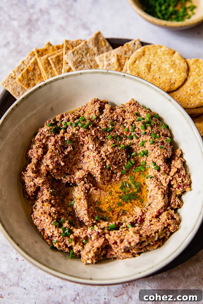 top down view of olive tapenade with crackers