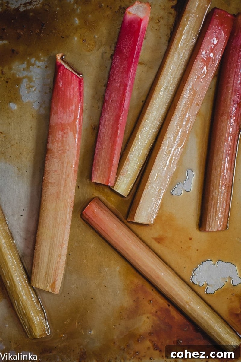 Freshly roasted rhubarb, tender and glistening in its own juices on a baking pan, ready to be incorporated into the tart.