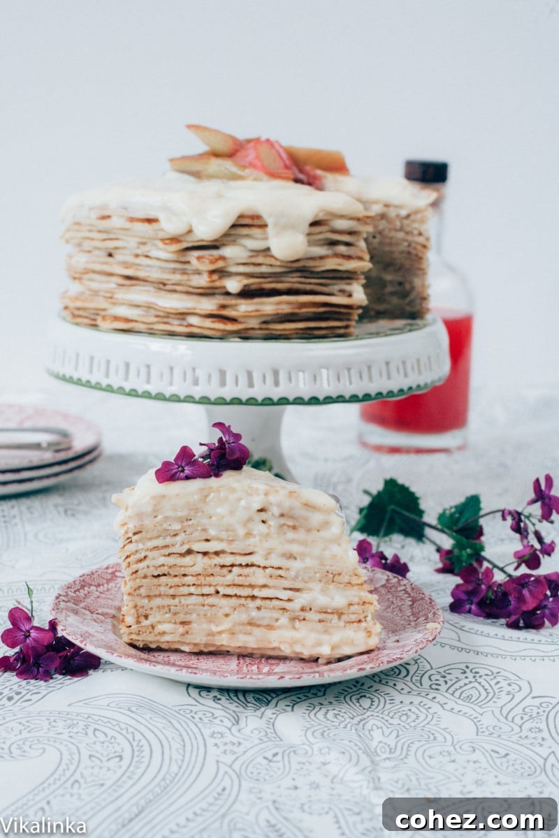 Piece of crepe cake with full cake in background
