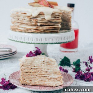 Piece of crepe cake with full cake in background