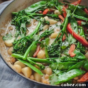 Vegetarian Thai Green Curry with new potatoes, snow peas, chickpeas and broccoli.