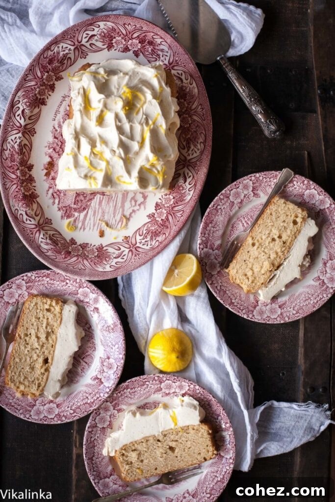 Lemon Ricotta Loaf Cake with a mound of Cream Cheese Frosting.