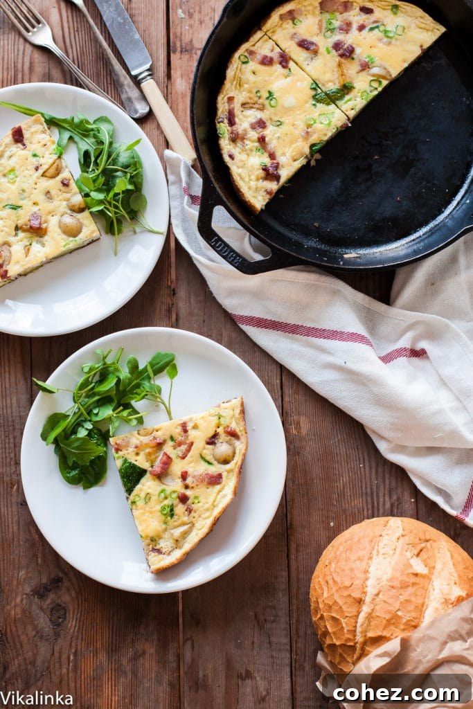 Loaded French Omelette with Bacon, Potatoes and Zucchini 5 A vibrant French Omelette with Bacon, Potatoes and Zucchini being prepared in a skillet