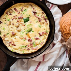 Loaded French Omelette with Bacon, Potatoes and Zucchini 7 omelette in cast iron pan