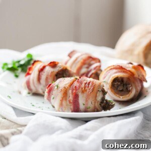 Close up of bacon wrapped chicken thighs on a plate, representing the final dish, with crispy bacon and a visible filling