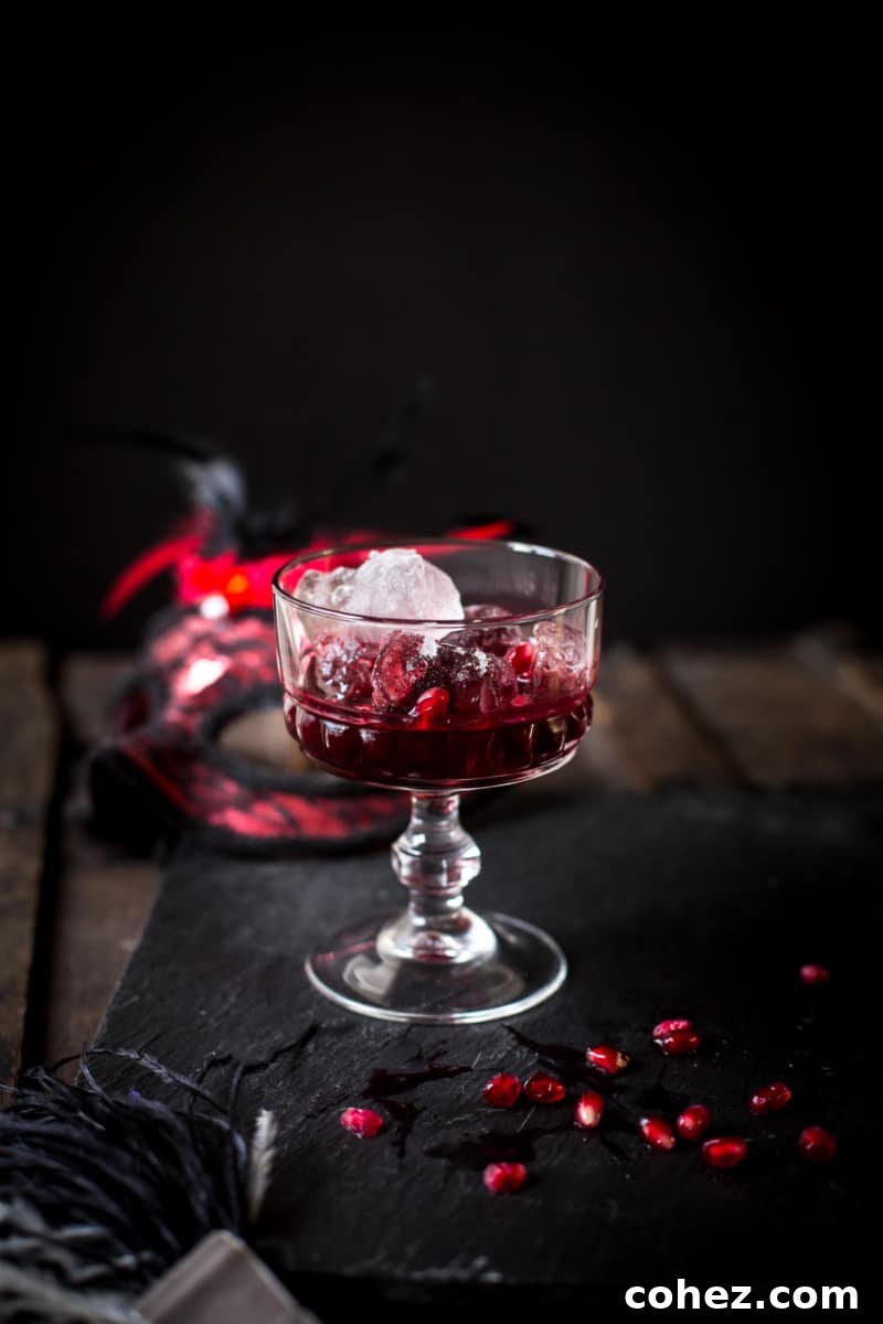 Summer Berry Serenade 3 Close-up of a Berry Crush cocktail, highlighting the crushed berries and rich red color, ready to be enjoyed.