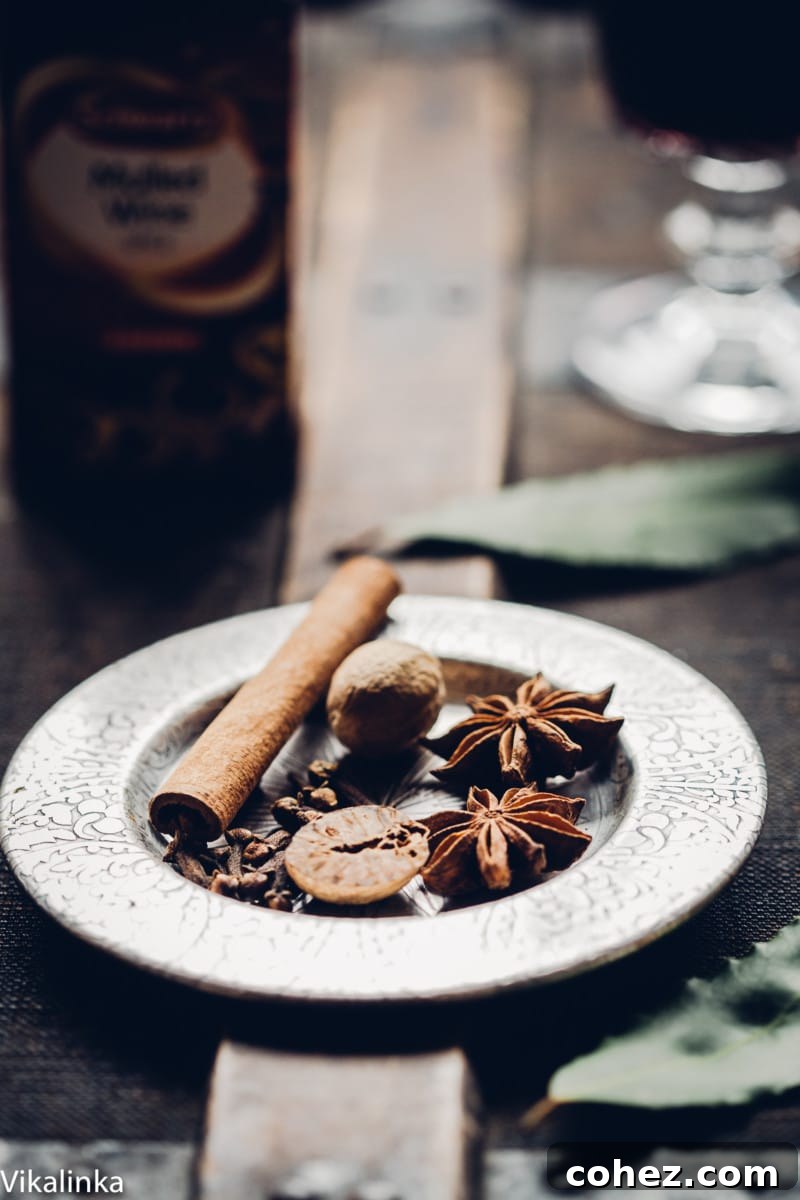 Assortment of festive spices and nuts on a silver plate, ready for mulled wine