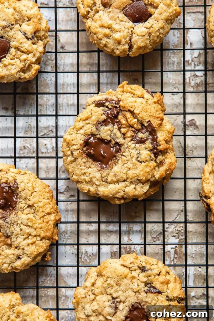 Top down shot of cowboy cookies with oats, chocolate and coconut on a wire rack