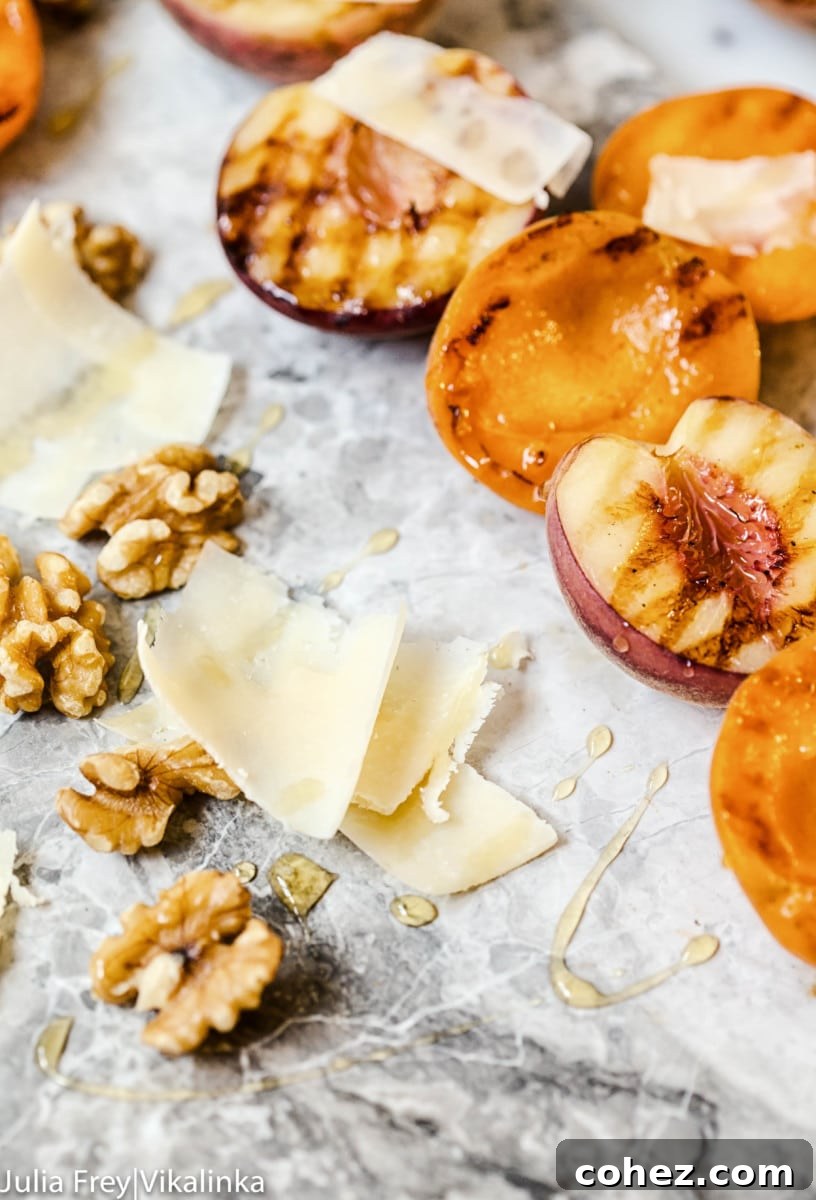 Close view of grilled apricots and walnuts alongside walnuts and grano padano shavings