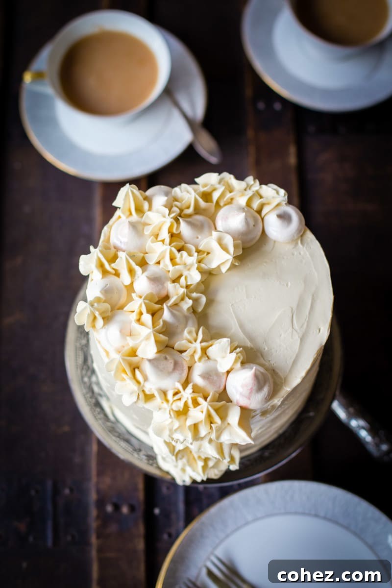 An inviting top-down view of the cake, beautifully arranged with teacups beside it, suggesting a perfect pairing.