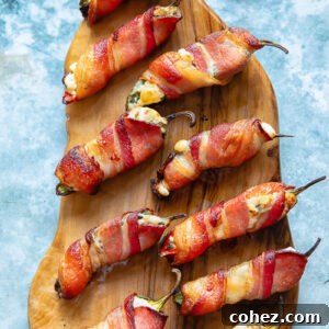 Bacon Wrapped Jalapeno Poppers on a cutting board