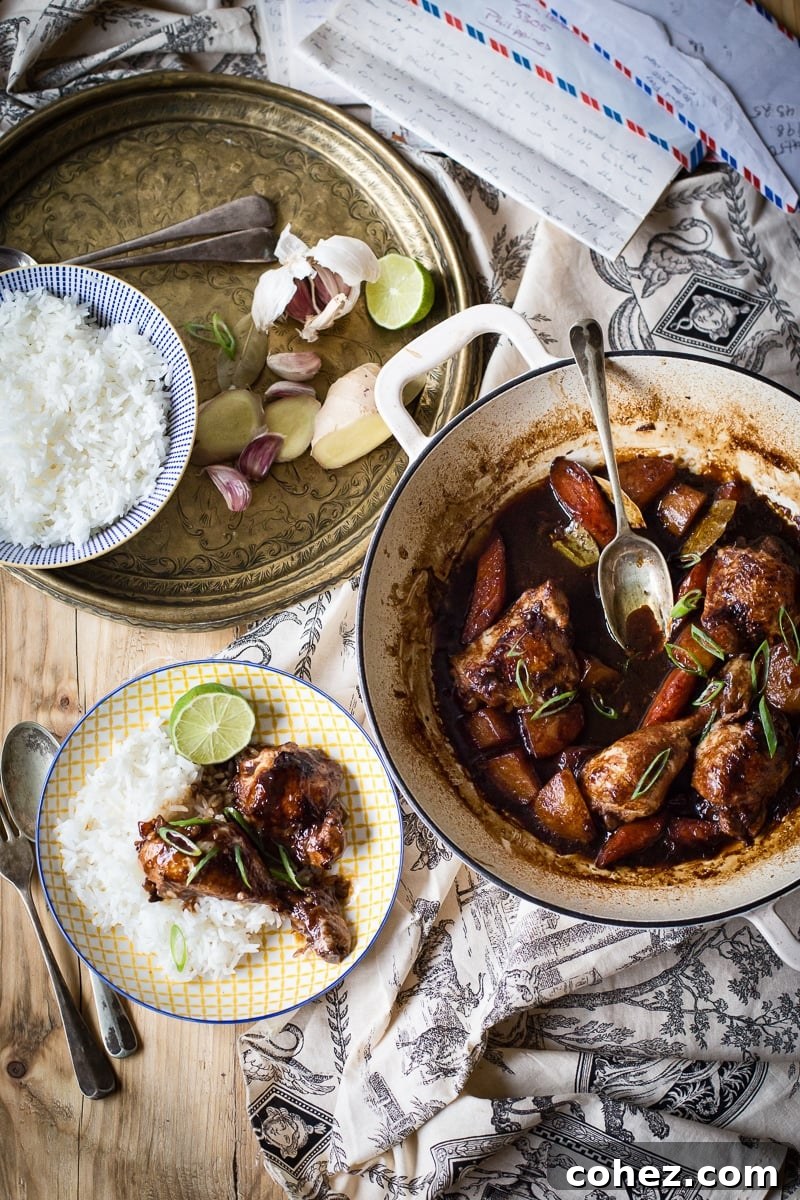 Table setting with the stew in a pot and on a plate with rice