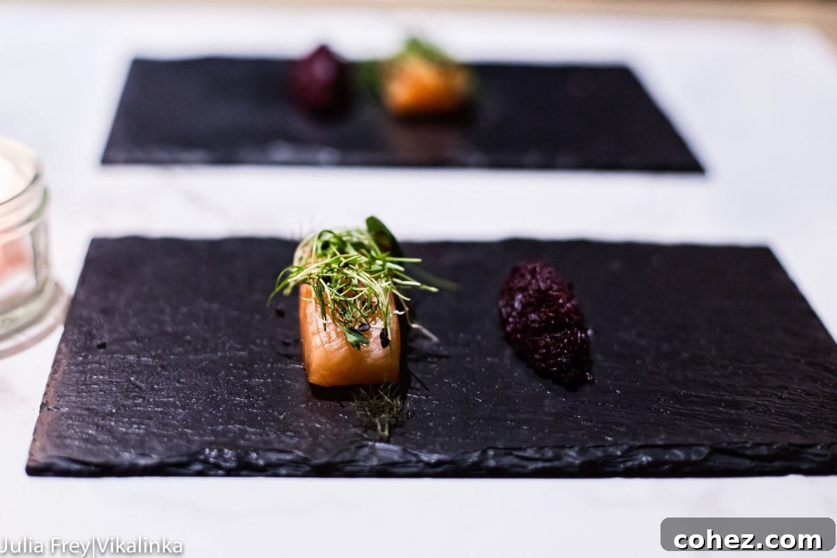 A vibrant and fresh-looking dish, possibly a gravlax or salad, with rich colors and appealing textures.