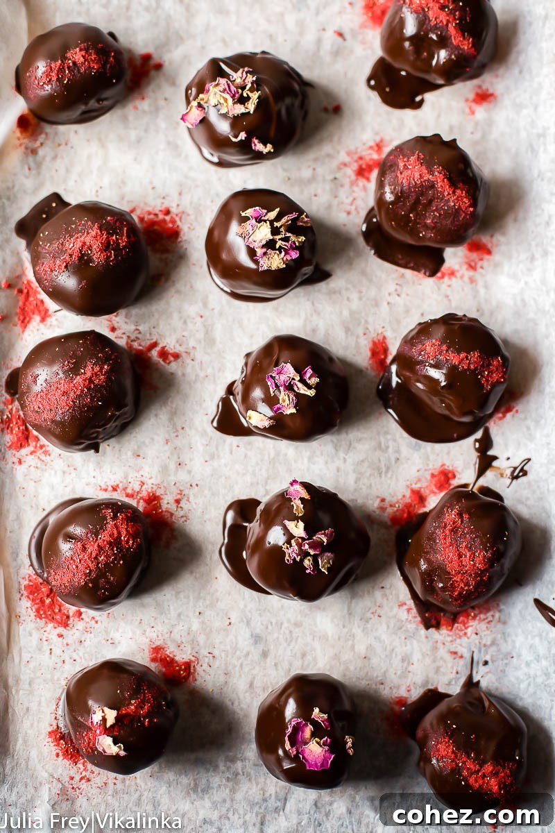 Three perfectly aligned rows of chocolate cake truffles, each one a testament to delicate craftsmanship, beautifully showcasing their uniform size and appealing texture.
