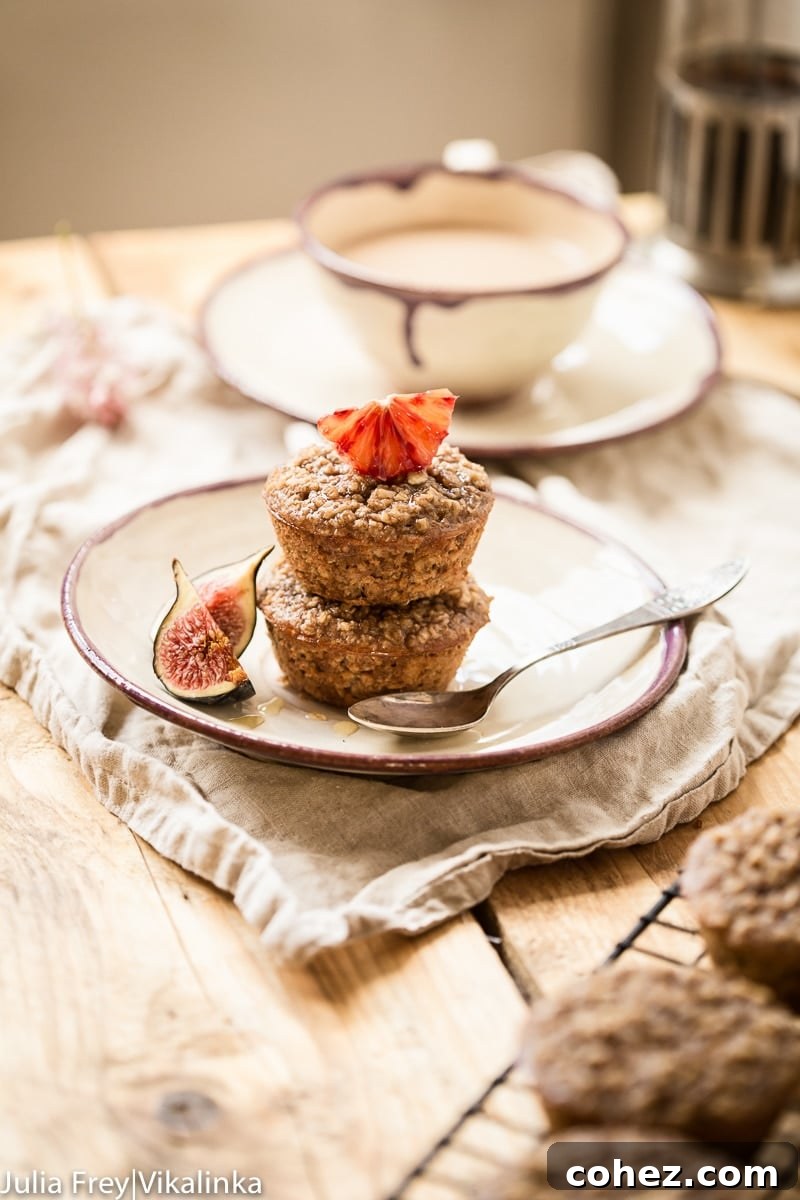 Two delightful flourless oatmeal muffins resting on a simple white plate, ready to be enjoyed.