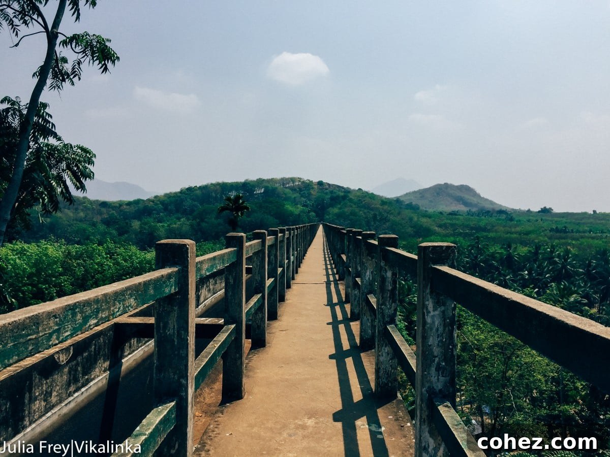 Serene view of an Indian lake or river with mountains in the background