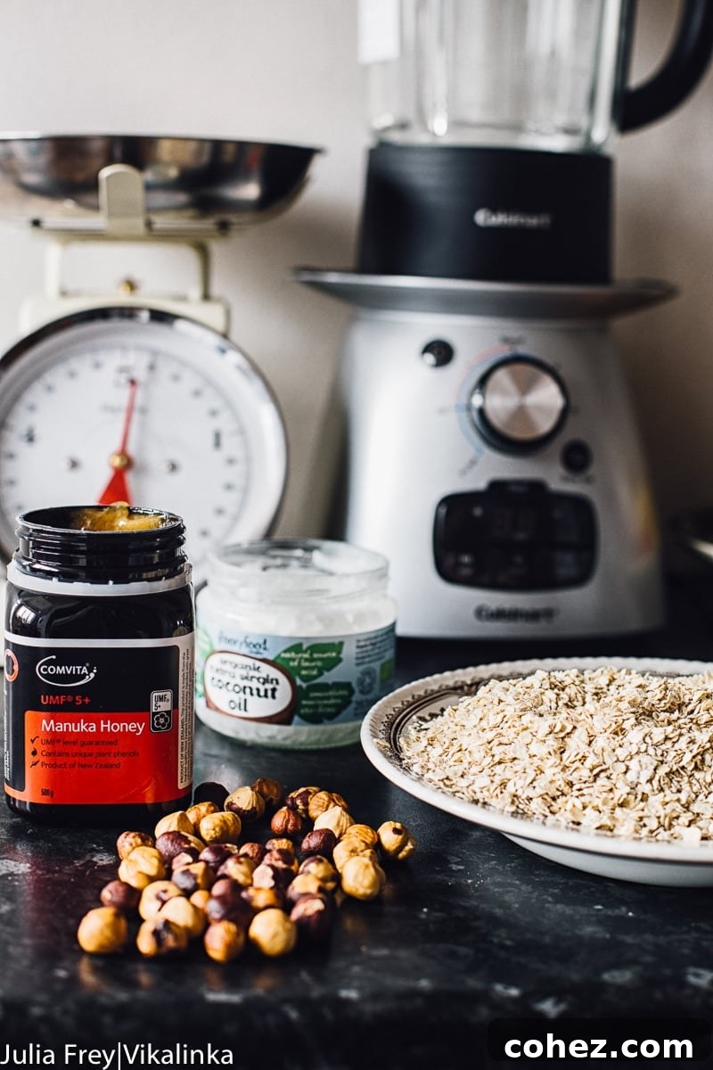 Golden Manuka Granola Bars 4 Selection of fresh ingredients laid out on a granite counter, including oats, honey, and nuts