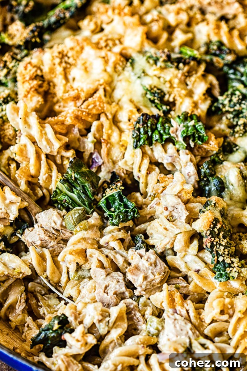 Close-up of baked Tuna Noodle Casserole with kale and golden topping, ready to serve