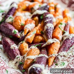 Colourful platter of roasted carrots with a side of tahini sauce