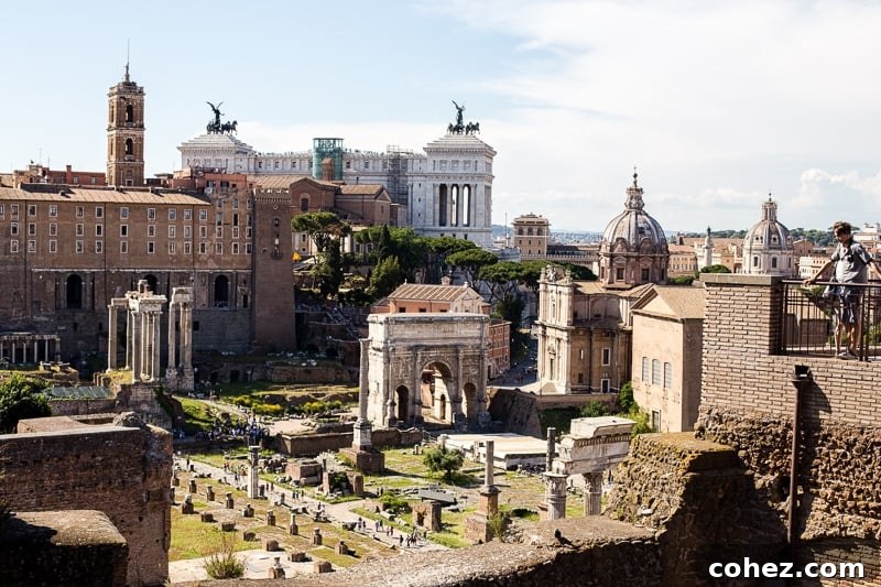 Ancient Roman Forum ruins with the Colosseum in the background, a historic landscape