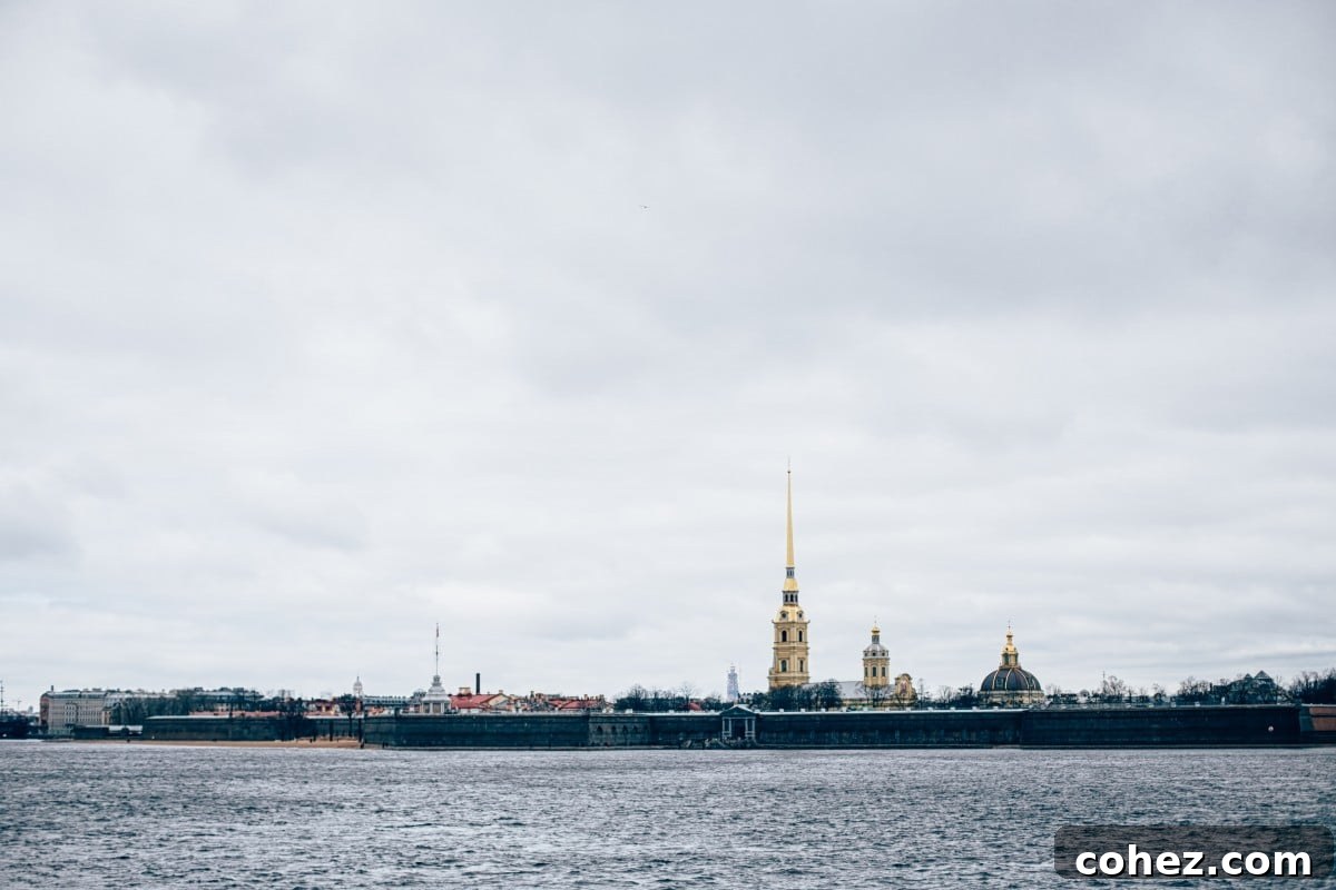 Waterfront promenade in Saint Petersburg with people enjoying the view