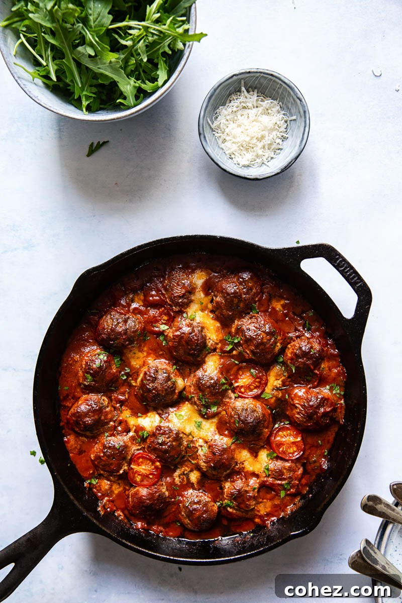 Baked Meatballs with Mozzarella and Arugula served over pasta